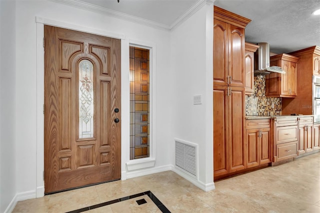 entryway with crown molding