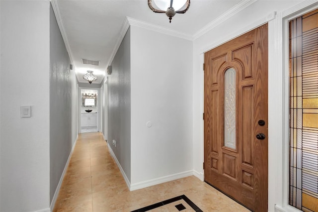 tiled foyer entrance with ornamental molding