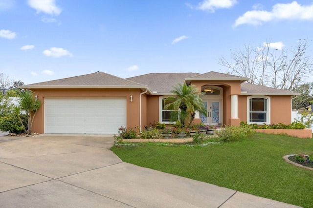 prairie-style home featuring a front yard and a garage