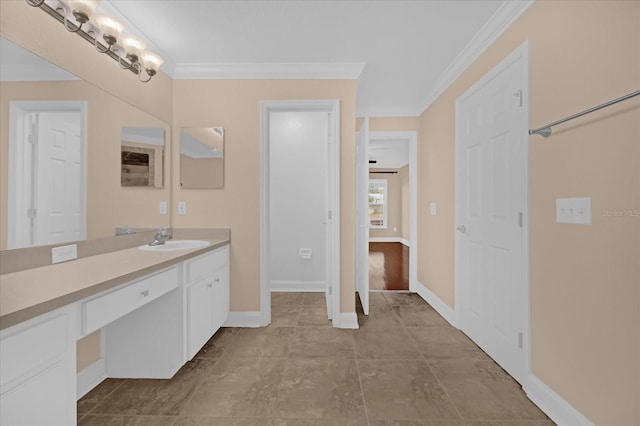 bathroom featuring crown molding and vanity