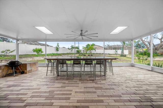 view of patio with ceiling fan and a grill