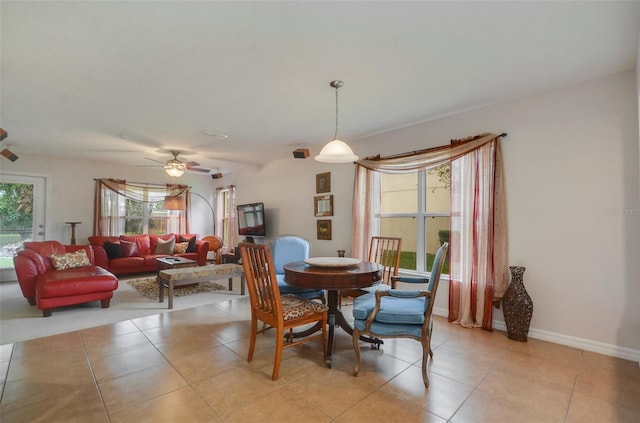 dining room featuring light tile patterned floors and ceiling fan