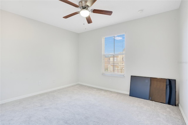 empty room with light carpet and ceiling fan