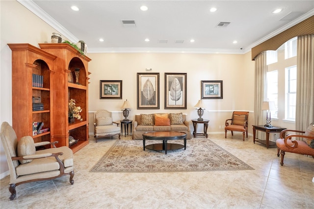 sitting room featuring light tile patterned floors and crown molding