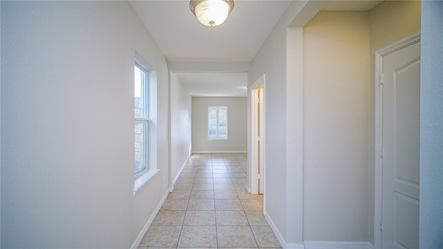 corridor featuring light tile patterned floors