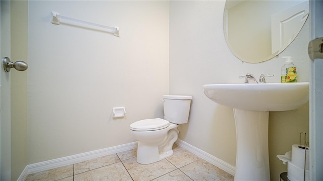 bathroom featuring tile patterned floors and toilet