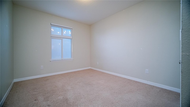 empty room with light colored carpet