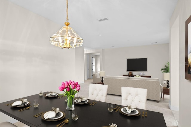 dining space featuring an inviting chandelier