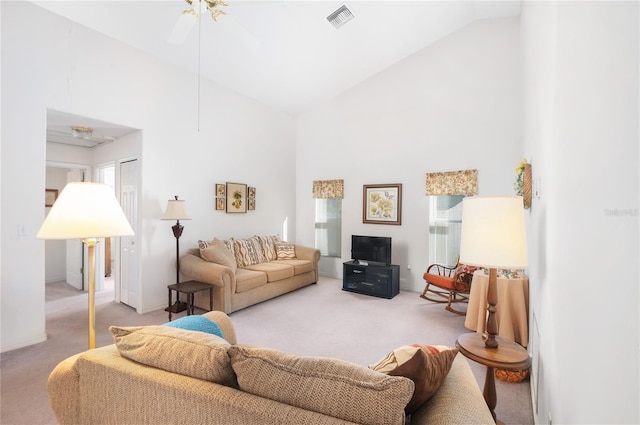 living room with carpet flooring, ceiling fan, plenty of natural light, and high vaulted ceiling