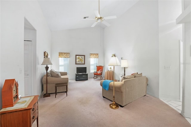 living room with ceiling fan, light colored carpet, and high vaulted ceiling