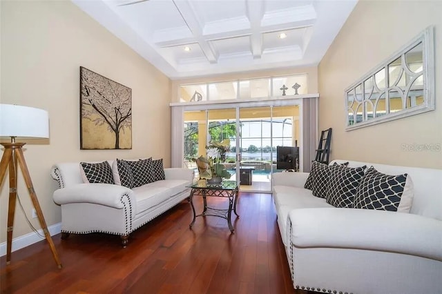 living room with beam ceiling, dark wood-type flooring, and coffered ceiling