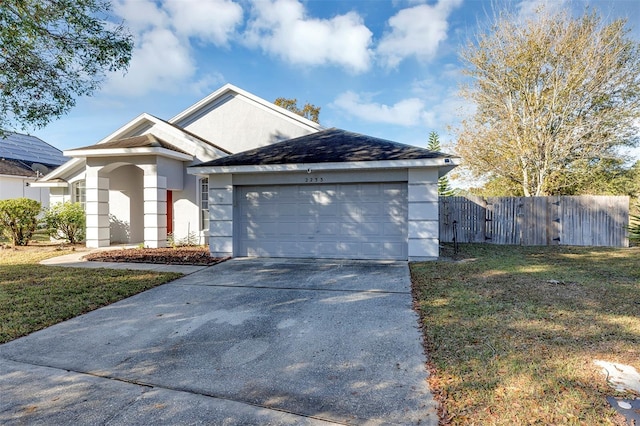 single story home with a garage and a front lawn