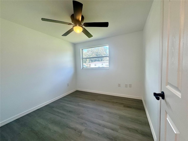 unfurnished room featuring ceiling fan and dark hardwood / wood-style floors