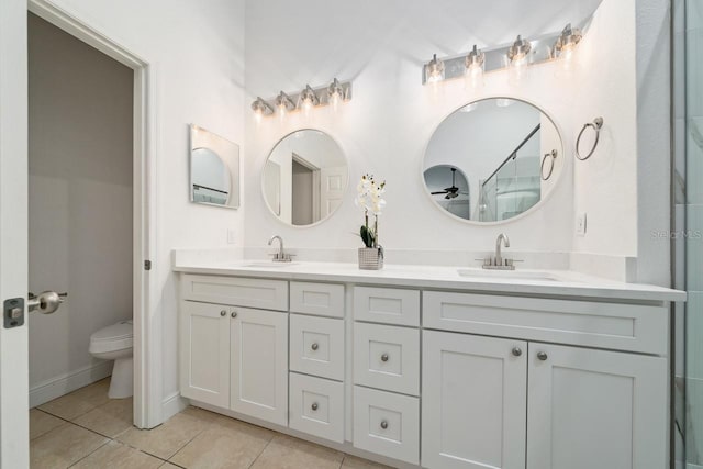 bathroom with tile patterned floors, vanity, and toilet