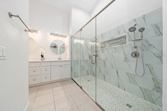 bathroom with vanity, tile patterned floors, and a shower with shower door