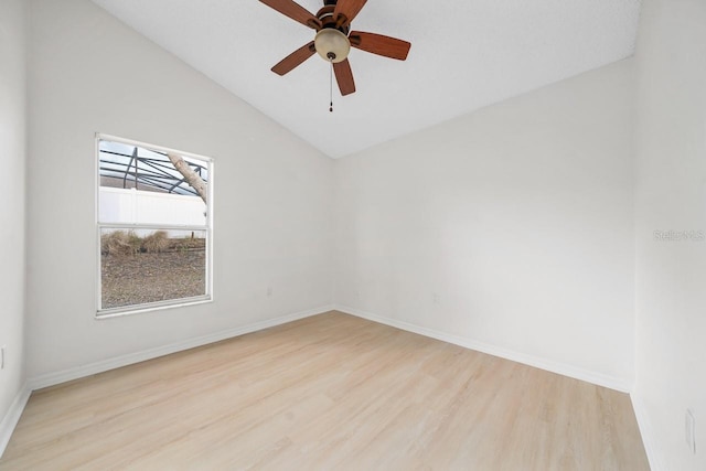 unfurnished room featuring ceiling fan, light hardwood / wood-style floors, and vaulted ceiling