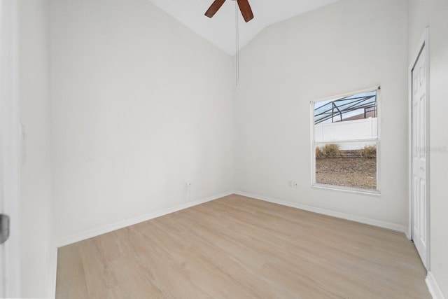 unfurnished room featuring ceiling fan, lofted ceiling, and light hardwood / wood-style flooring