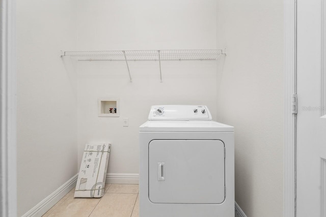 laundry room featuring washer / dryer and light tile patterned flooring