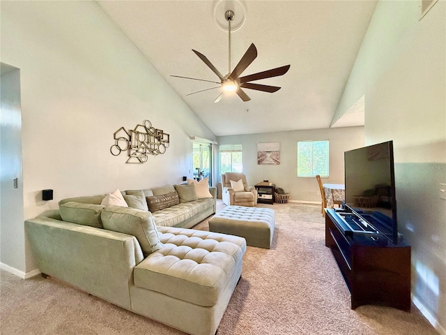 carpeted living room featuring ceiling fan and high vaulted ceiling