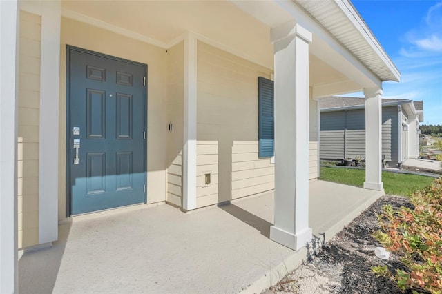 property entrance with covered porch