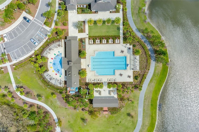 birds eye view of property with a water view