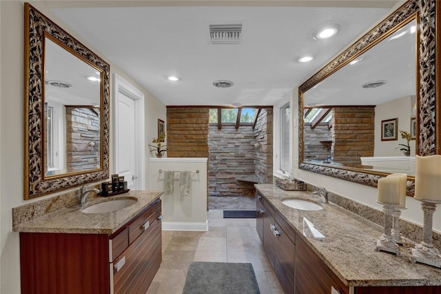 bathroom with tile patterned floors and vanity