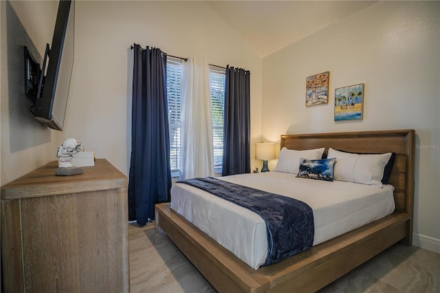 bedroom with lofted ceiling