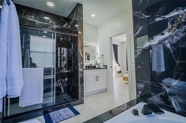 bathroom with vanity and an enclosed shower