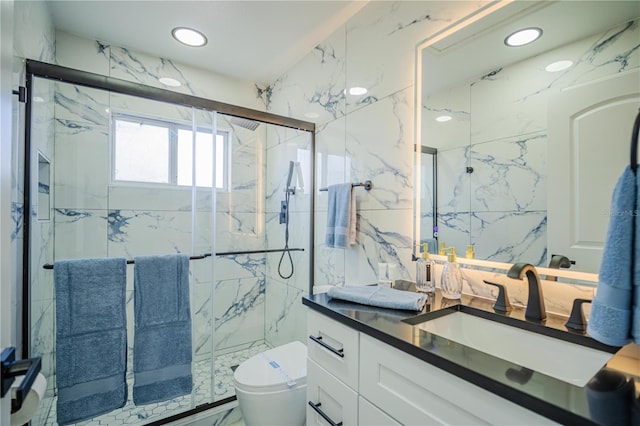 bathroom featuring vanity, toilet, and a shower with door