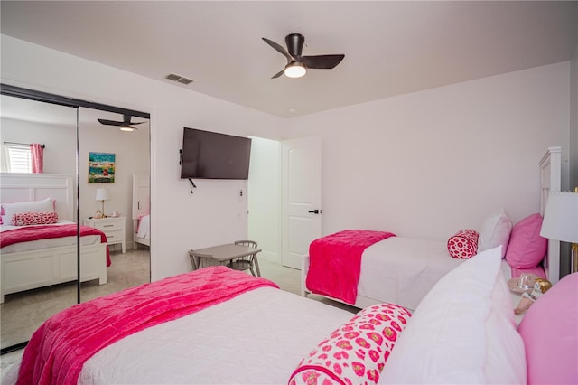 bedroom featuring ceiling fan and a closet