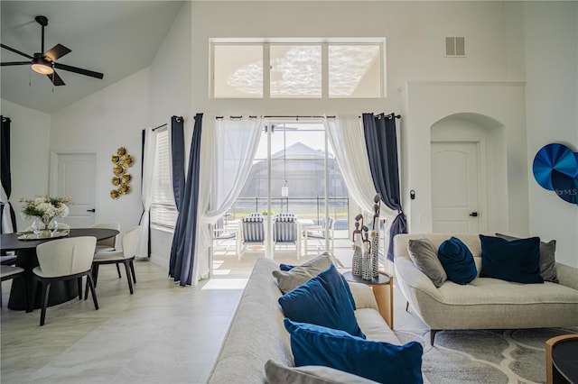 living room with high vaulted ceiling and ceiling fan