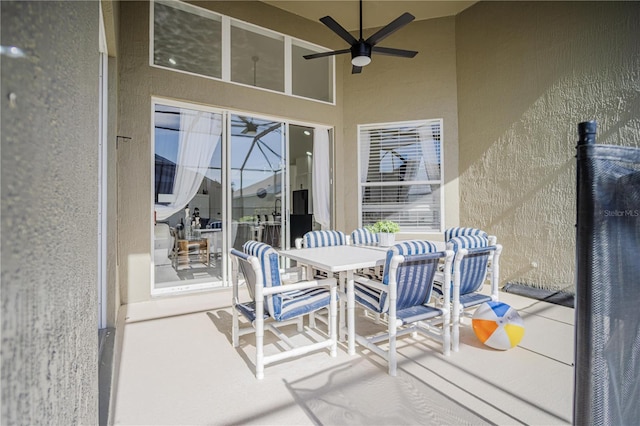 view of patio featuring ceiling fan