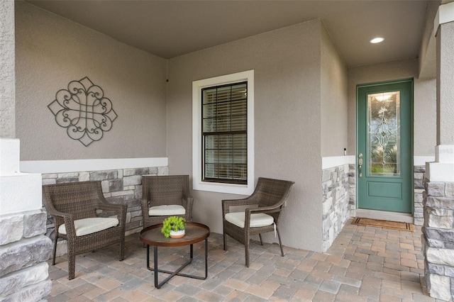 doorway to property with a patio