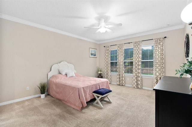 carpeted bedroom featuring ceiling fan and ornamental molding