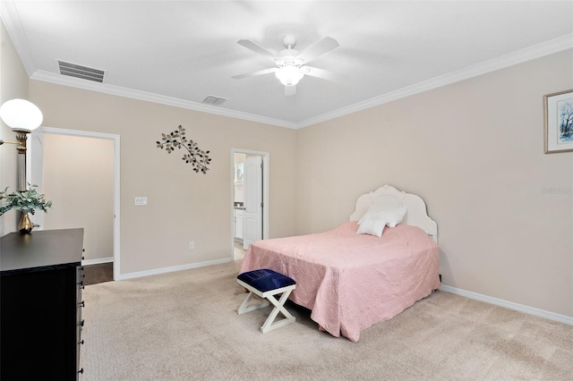 bedroom featuring ceiling fan, ornamental molding, light carpet, and connected bathroom