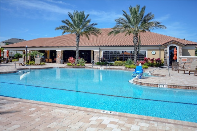 view of swimming pool featuring a patio