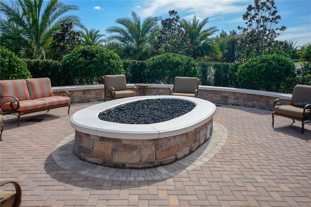 view of patio / terrace featuring an outdoor fire pit