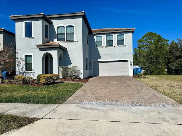 view of front of house featuring a garage and a front yard