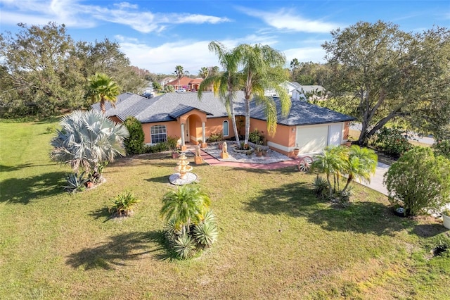 view of front of house featuring a front yard and a garage