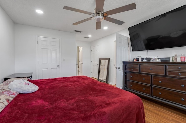 bedroom featuring ceiling fan and light hardwood / wood-style flooring