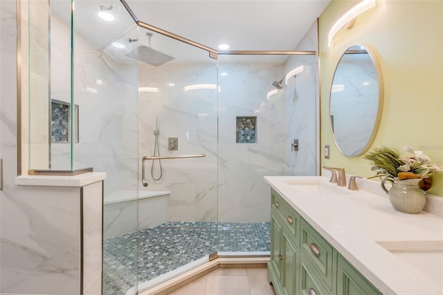 bathroom featuring vanity, tile patterned floors, and a shower with door