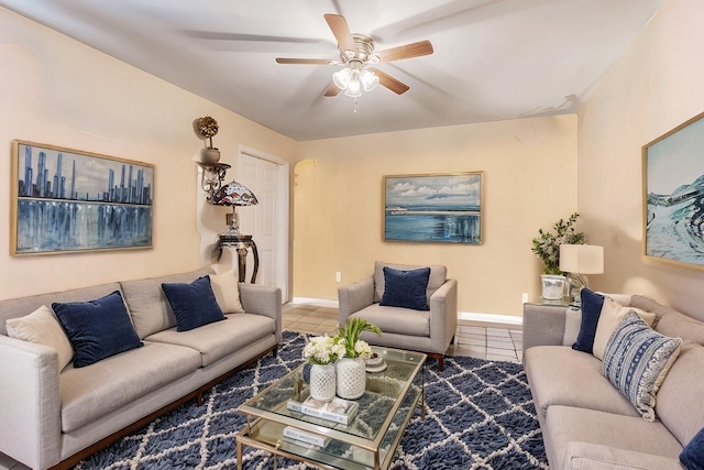 living room featuring tile patterned flooring and ceiling fan