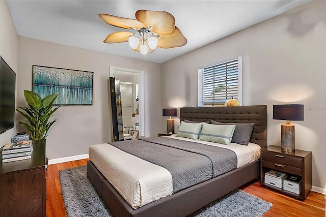 bedroom with hardwood / wood-style flooring and ceiling fan