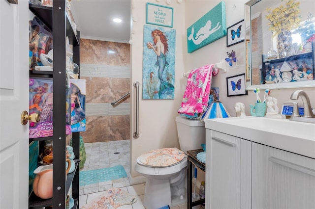 bathroom with vanity, crown molding, a shower, tile patterned flooring, and toilet