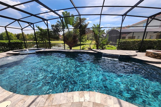 view of pool featuring an in ground hot tub, a patio, and glass enclosure