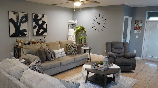 tiled living room with ceiling fan