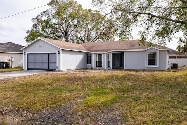 ranch-style home with a front yard, a garage, and central air condition unit