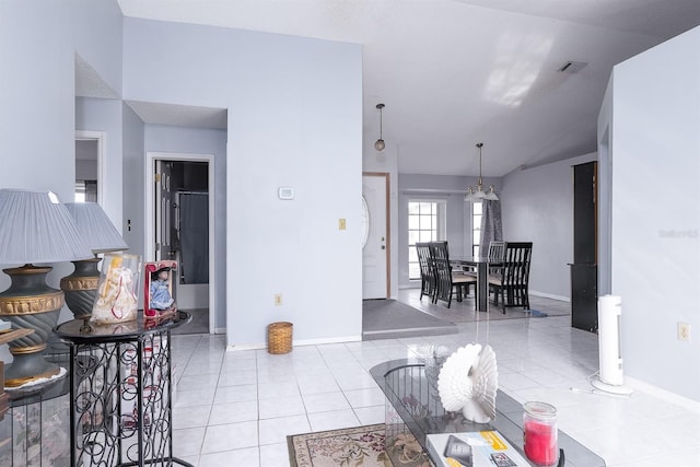 tiled living room featuring lofted ceiling