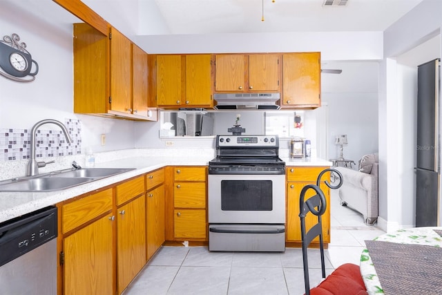 kitchen featuring light tile patterned floors, sink, and appliances with stainless steel finishes