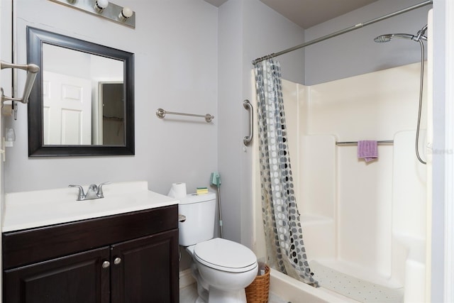 bathroom with toilet, vanity, and a shower with shower curtain